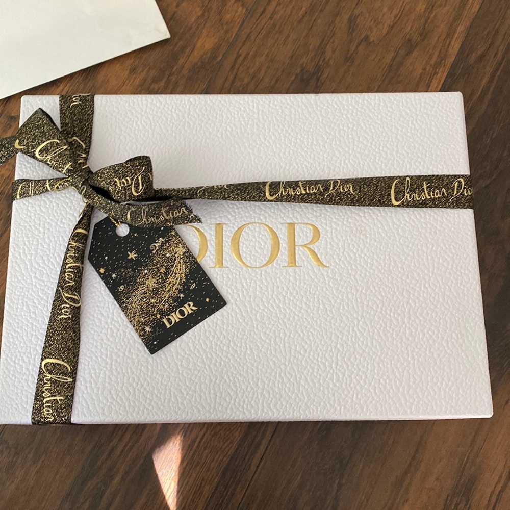 Dior beauty gift box with gold and black ribbon